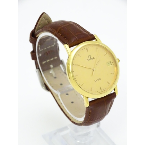 950 - An Omega 18ct gold cased De Ville wristwatch, the dial with hour batons and date aperture. Watch cas... 