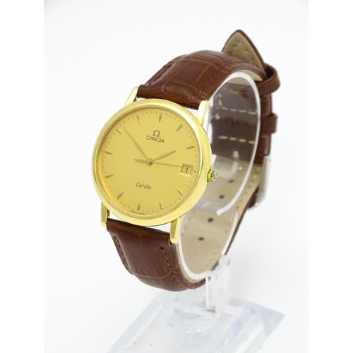 950 - An Omega 18ct gold cased De Ville wristwatch, the dial with hour batons and date aperture. Watch cas... 