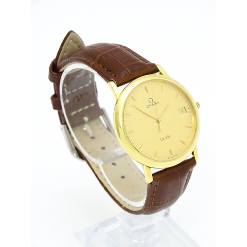 950 - An Omega 18ct gold cased De Ville wristwatch, the dial with hour batons and date aperture. Watch cas... 