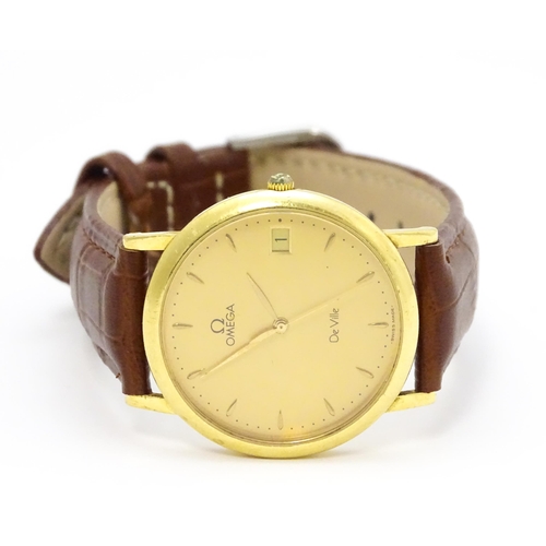 950 - An Omega 18ct gold cased De Ville wristwatch, the dial with hour batons and date aperture. Watch cas... 