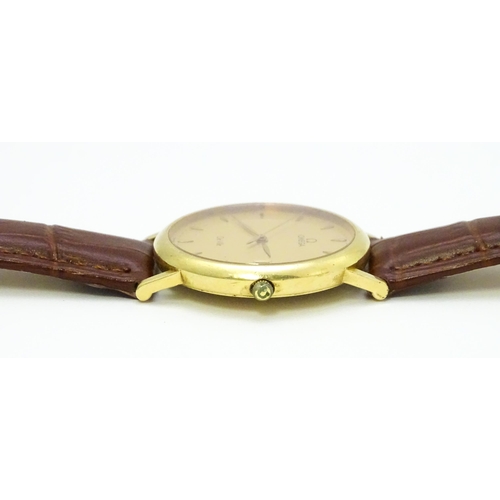 950 - An Omega 18ct gold cased De Ville wristwatch, the dial with hour batons and date aperture. Watch cas... 