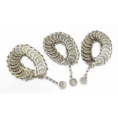 955 - Three bracelets with coin style detail. (3)