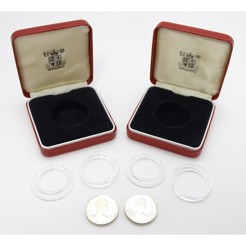 956 - Coins: Two silver proof £1 coins. Boxed. (2)