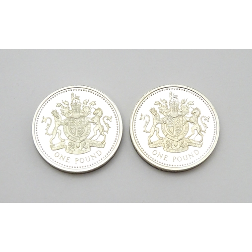 956 - Coins: Two silver proof £1 coins. Boxed. (2)