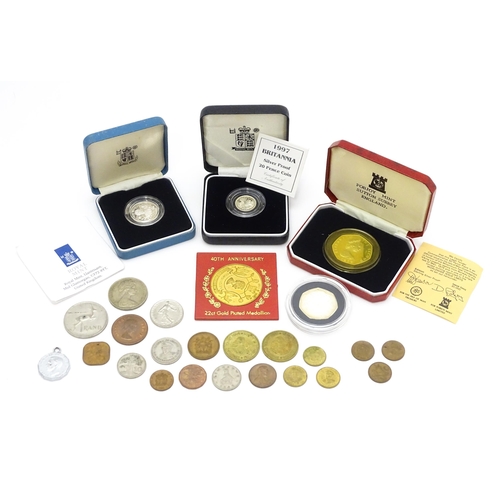 957 - Coins: A quantity of assorted coins to include a Pobjoy Mint commemorative 50p, 1997 Britannia silve... 