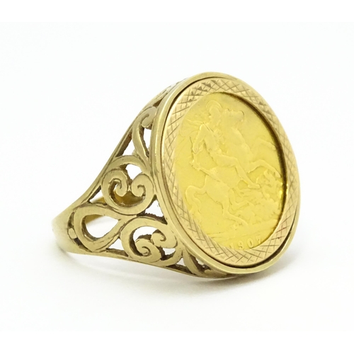 960 - A 9ct gold ring set with a half sovereign coin. Ring size approx. S 1/2