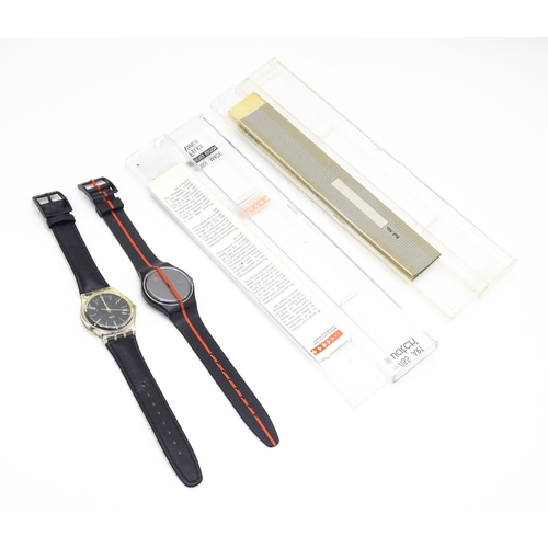 941 - Two Swatch watches with quartz movements, one a numbered edition designed by Felice Varini (2)