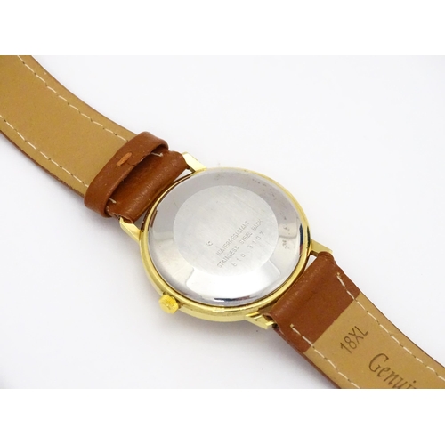 945 - A Candino 3000S wristwatch, the gold plated stainless steel case with a red guilloche enamel dial wi... 