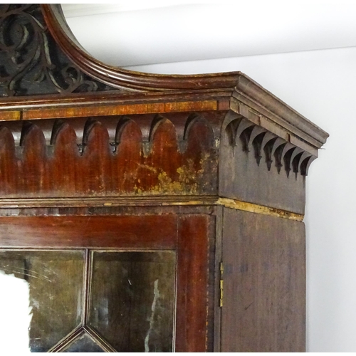 1530 - A George II / George III low waisted bookcase with an impressive swans neck architectural pediment w... 