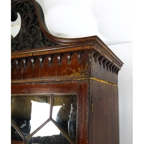 1530 - A George II / George III low waisted bookcase with an impressive swans neck architectural pediment w... 