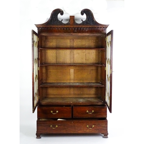 1530 - A George II / George III low waisted bookcase with an impressive swans neck architectural pediment w... 