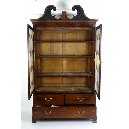 1530 - A George II / George III low waisted bookcase with an impressive swans neck architectural pediment w... 