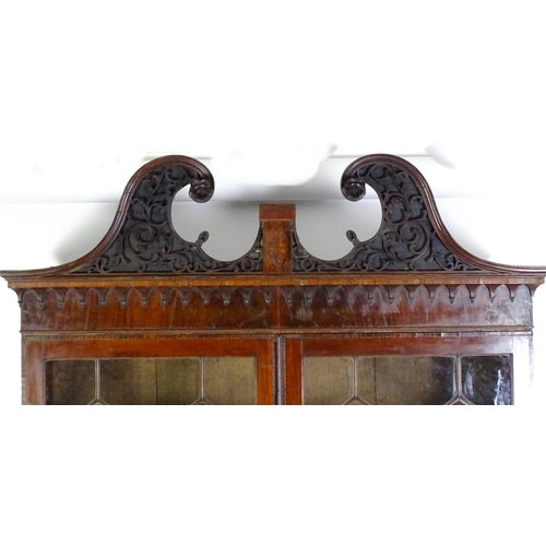 1530 - A George II / George III low waisted bookcase with an impressive swans neck architectural pediment w... 