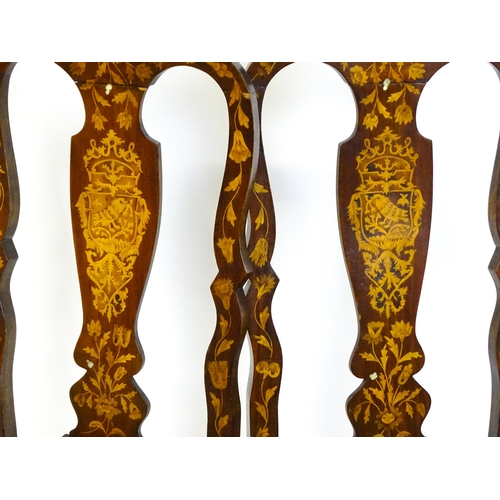 1546 - A group of late 19thC and early 20thC marquetry inlaid side chairs in the George I style, having sat... 