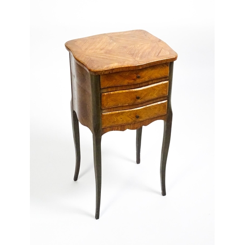 1569 - An early 20thC Kingwood bedside table with three short drawers raised on cabriole legs. 16