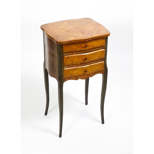 1569 - An early 20thC Kingwood bedside table with three short drawers raised on cabriole legs. 16