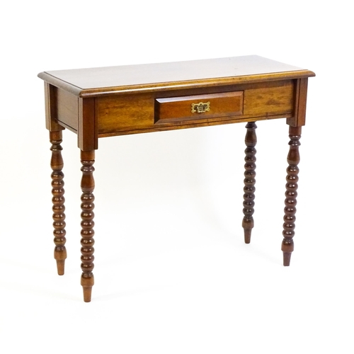 1583 - A mahogany side table / console table with a moulded rectangular top above a single frieze drawer an... 