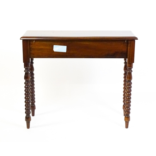 1583 - A mahogany side table / console table with a moulded rectangular top above a single frieze drawer an... 