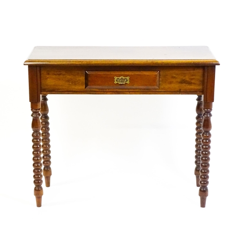 1583 - A mahogany side table / console table with a moulded rectangular top above a single frieze drawer an... 