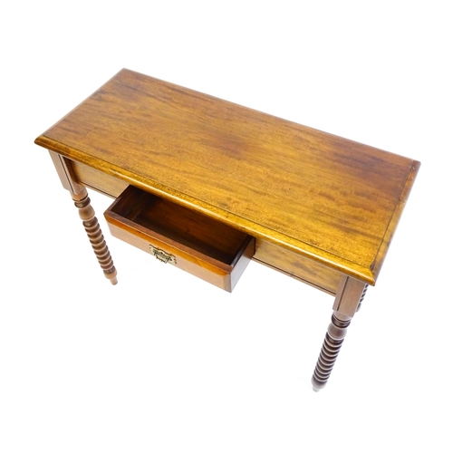 1583 - A mahogany side table / console table with a moulded rectangular top above a single frieze drawer an... 