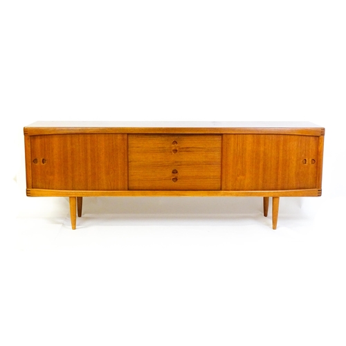 1756 - Vintage / Retro: A Danish teak sideboard designed by H.W.Klein for Bramin. With a bank of four drawe... 