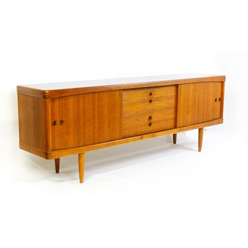 1756 - Vintage / Retro: A Danish teak sideboard designed by H.W.Klein for Bramin. With a bank of four drawe... 