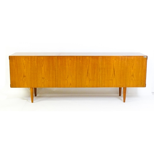 1756 - Vintage / Retro: A Danish teak sideboard designed by H.W.Klein for Bramin. With a bank of four drawe... 