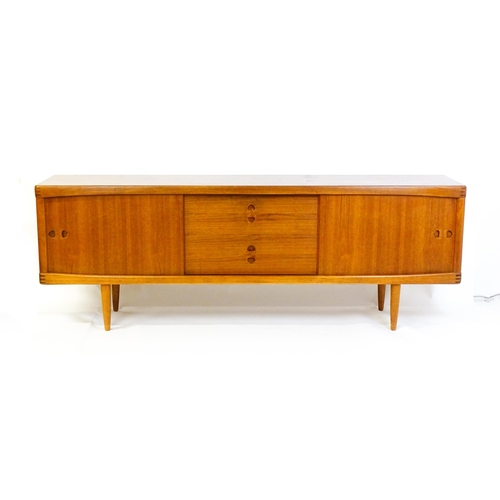 1756 - Vintage / Retro: A Danish teak sideboard designed by H.W.Klein for Bramin. With a bank of four drawe... 