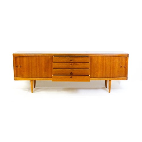 1756 - Vintage / Retro: A Danish teak sideboard designed by H.W.Klein for Bramin. With a bank of four drawe... 