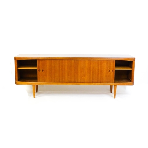 1756 - Vintage / Retro: A Danish teak sideboard designed by H.W.Klein for Bramin. With a bank of four drawe... 