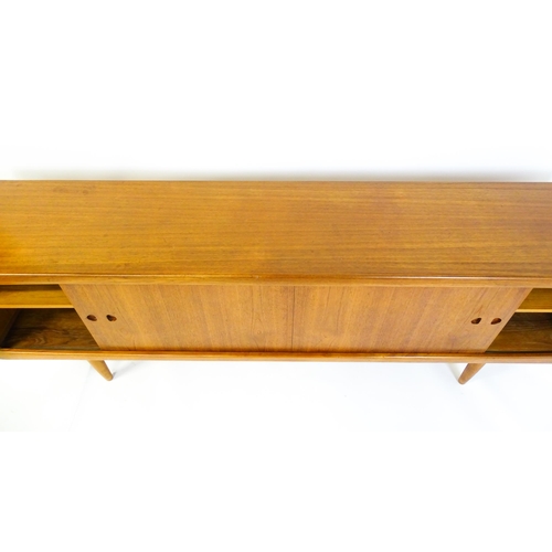 1756 - Vintage / Retro: A Danish teak sideboard designed by H.W.Klein for Bramin. With a bank of four drawe... 