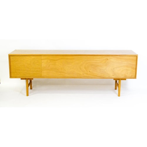 1759 - Vintage / Retro: A teak sideboard by 'Avalon'. The sideboard having three cupboards  and three drawe... 