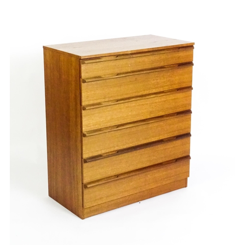 1760 - A vintage retro teak chest of drawers with six graduated drawers. 32