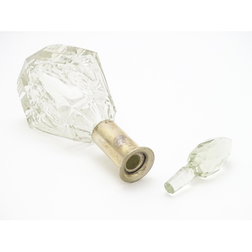 326 - A cut glass scent / perfume bottle / flask with German .800 silver mount. Approx. 8 1/2