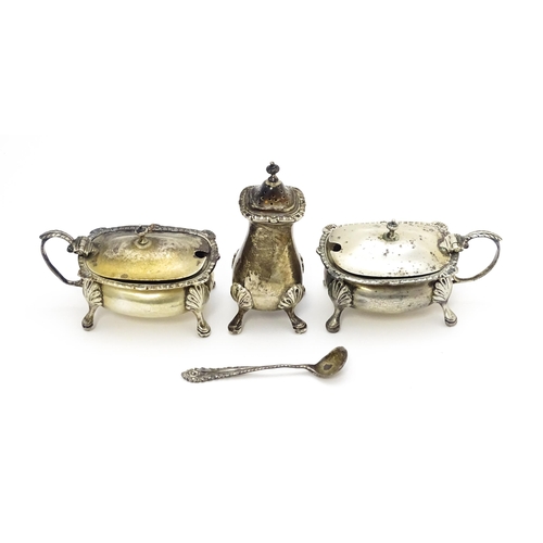 350A - Three silver cruet items comprising pepper, and two mustard pots with a spoon, hallmarked Birmingham... 