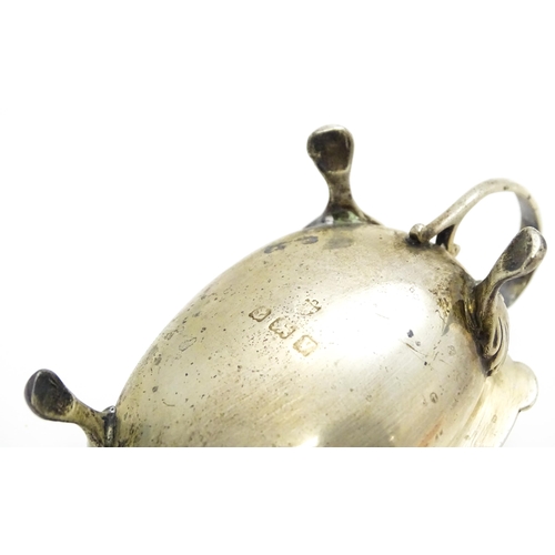 350A - Three silver cruet items comprising pepper, and two mustard pots with a spoon, hallmarked Birmingham... 