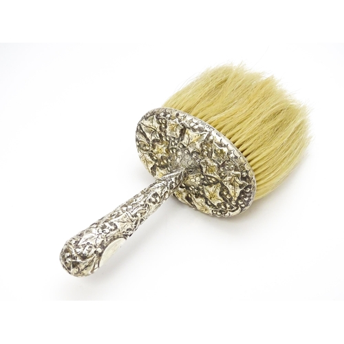 357 - A Victorian silver handled hat brush with foliate decoration, hallmarked London 1889, maker Charles ... 