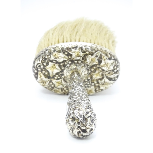 357 - A Victorian silver handled hat brush with foliate decoration, hallmarked London 1889, maker Charles ... 