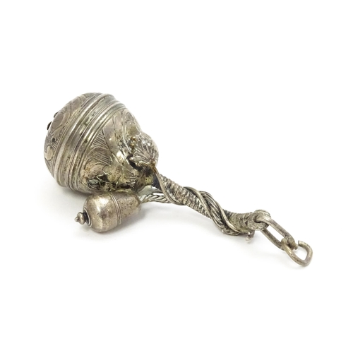 386 - A late 18th /  early 19thC white metal pomander pendant of shaped form with acorn formed drop, unscr... 