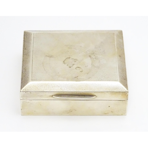 427 - A silver cigarette box with engine turned decoration hallmarked Birmingham 1951, maker Poston Produc... 