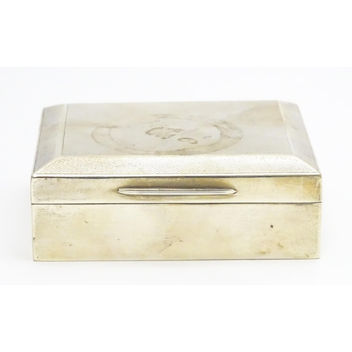 427 - A silver cigarette box with engine turned decoration hallmarked Birmingham 1951, maker Poston Produc... 