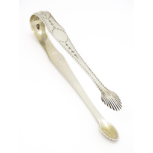 428 - Early 19thC Irish silver sugar tongs with bright cut decoration, hallmarked Dublin c. 1800, maker Ge... 