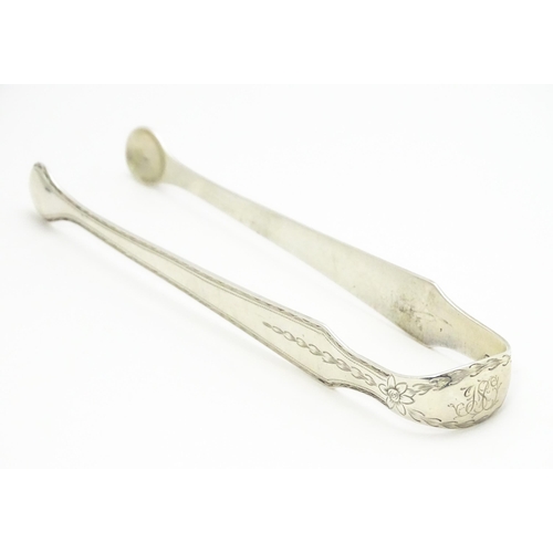 428 - Early 19thC Irish silver sugar tongs with bright cut decoration, hallmarked Dublin c. 1800, maker Ge... 