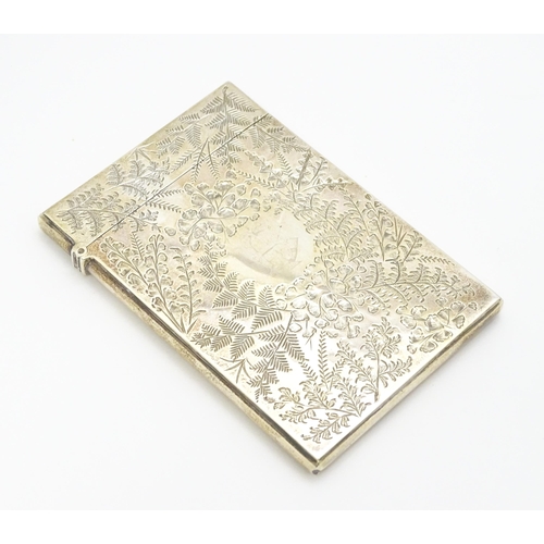 430 - A Victorian silver visiting card case with engraved foliate decoration hallmarked Birmingham 1890, m... 