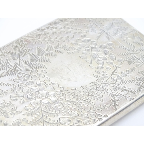 430 - A Victorian silver visiting card case with engraved foliate decoration hallmarked Birmingham 1890, m... 