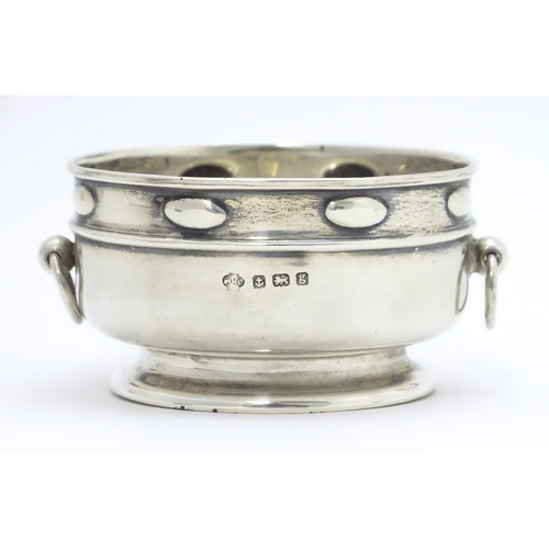 435 - An Arts & Crafts silver bowl with twin ring handles and banded detail, hallmarked Birmingham 1906, m... 