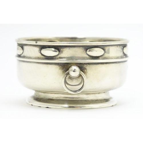 435 - An Arts & Crafts silver bowl with twin ring handles and banded detail, hallmarked Birmingham 1906, m... 