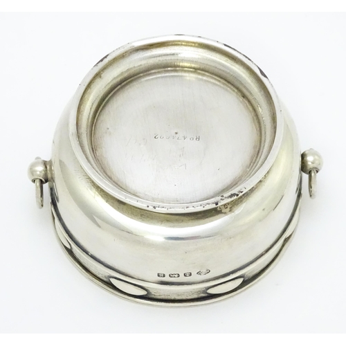 435 - An Arts & Crafts silver bowl with twin ring handles and banded detail, hallmarked Birmingham 1906, m... 