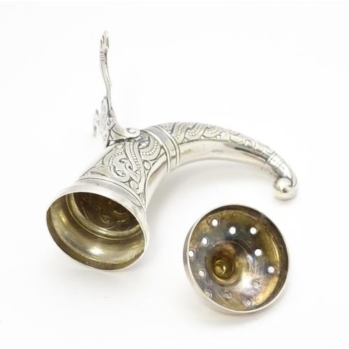 437 - Scandinavian Silver: A Norwegian silver pepper formed as a hunting horn with engraved decoration, ma... 