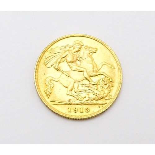 962 - Coin : A 1913 gold half sovereign coin. Total weight approx. 4g